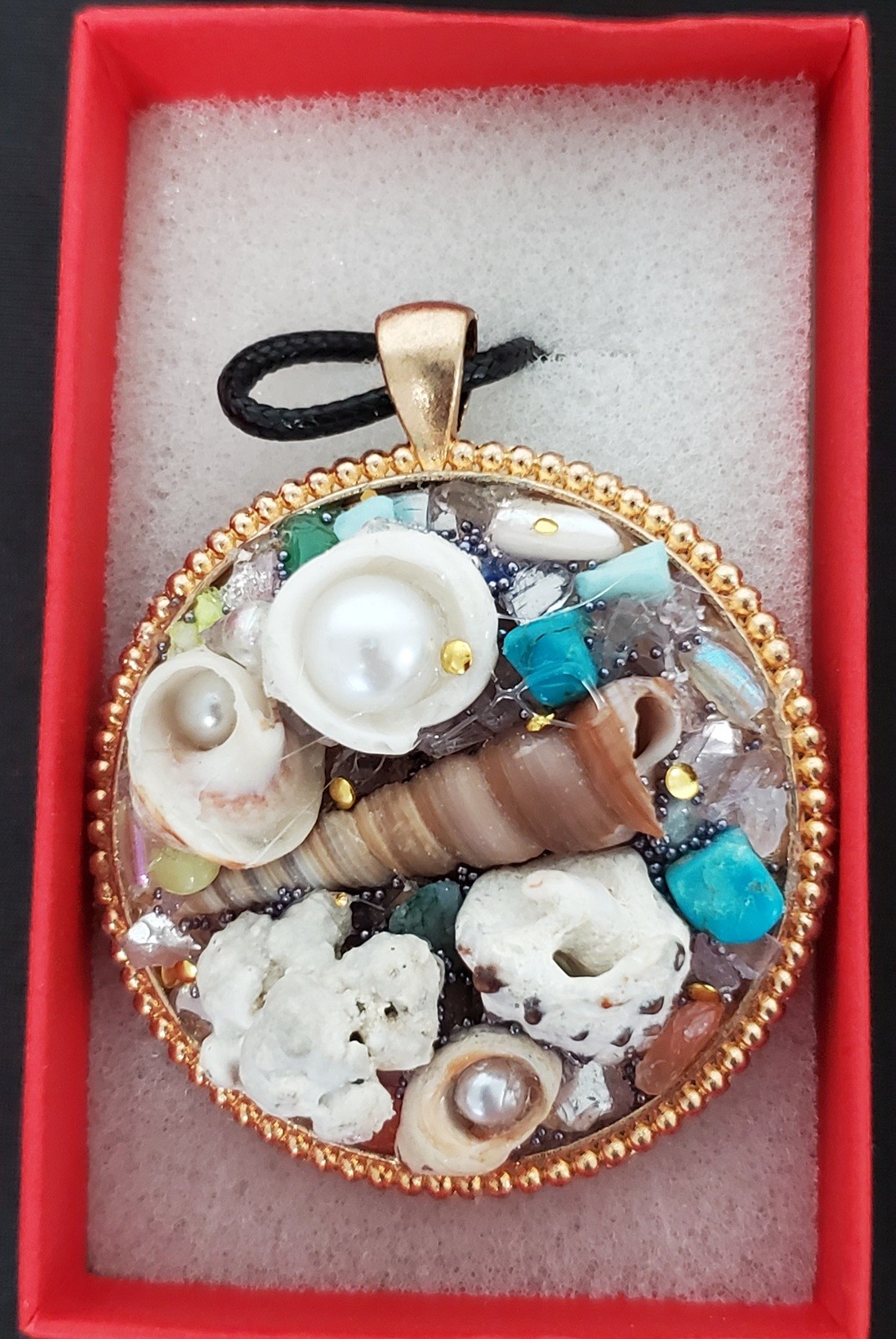 Pendant of Many Seashells by Theresa Moleski